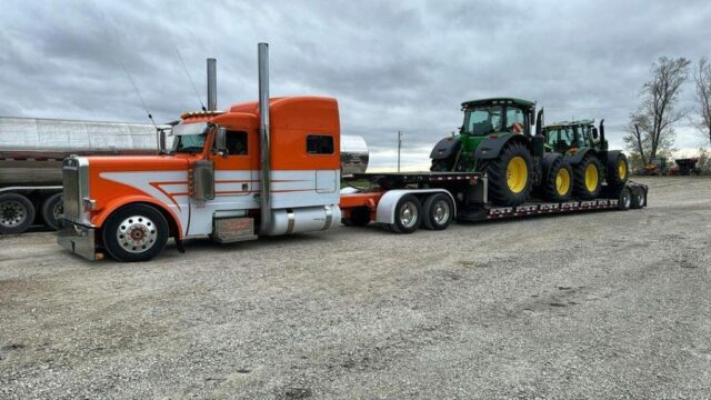 Two John Deeres rolling out in style.