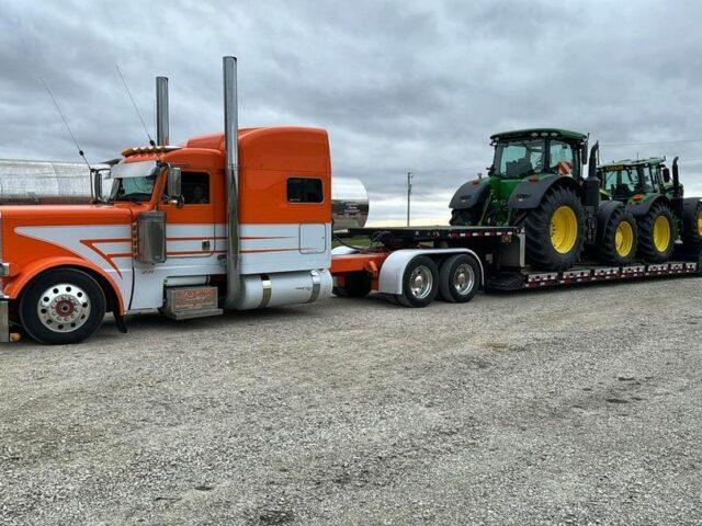 Two John Deeres rolling out in style.